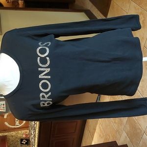 Broncos long sleeve bling t shirt. One of my favorites. Fits more like a large,